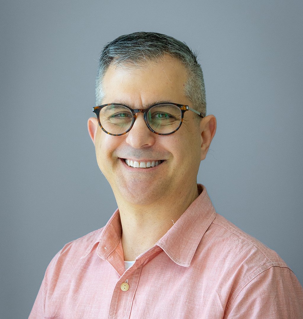 Marc_Headshot-FInal-GrayBG_Website 2