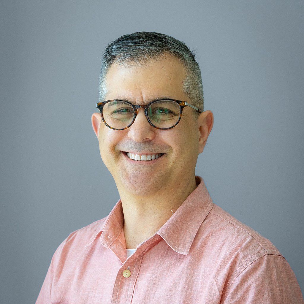 Marc_Headshot-FInal-GrayBG_Website